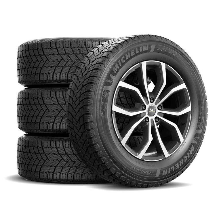 Michelin X-Ice Snow+ winter tires — Michelin's official product image, front tire mounted with a stack of three behind