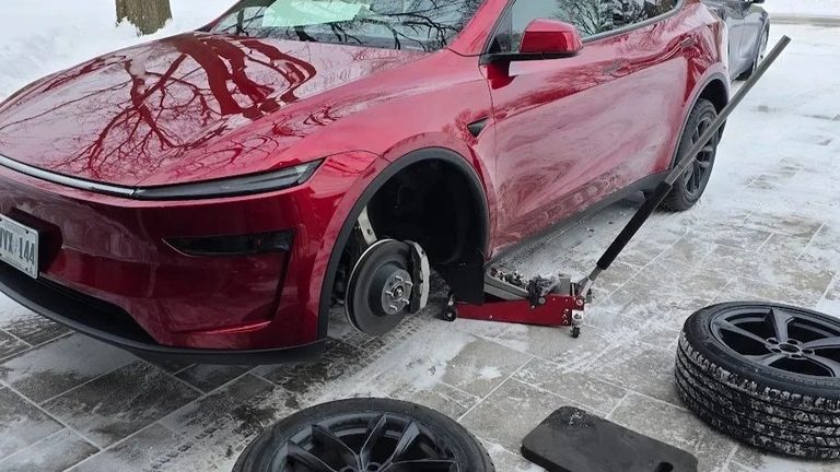Tesla Model Y 18-inch winter tire package being installed by Sparky X