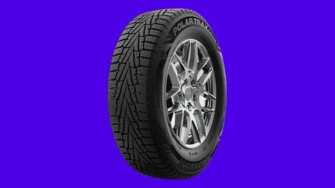 Ironman Polar Trax Gen2 winter tire on an electric indigo background