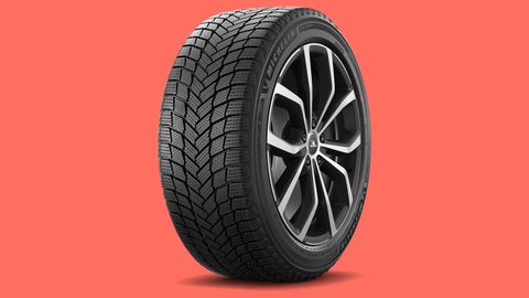 Michelin X-Ice Snow+ winter tire on a living coral background