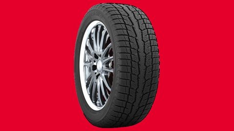Toyo Observe GSi-6 winter tire on a crimson background